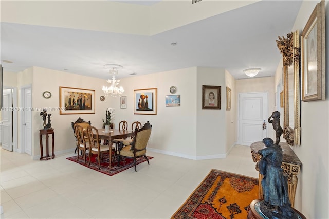 dining area featuring baseboards, a notable chandelier, and light tile patterned floors
