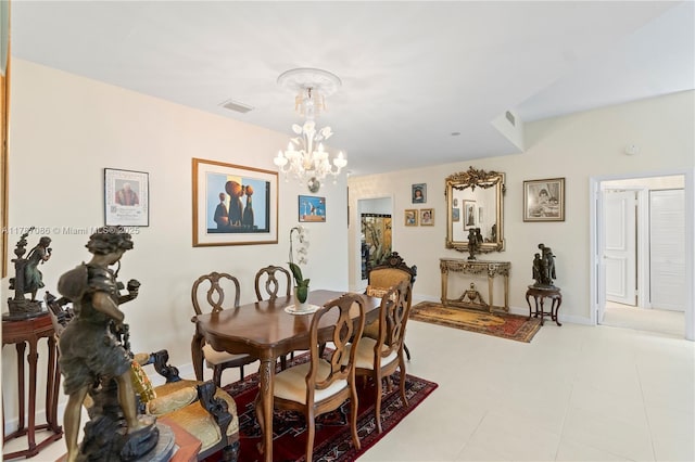 dining room with visible vents, baseboards, and a notable chandelier