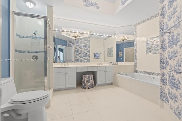 full bath with a stall shower, a sink, a notable chandelier, and toilet