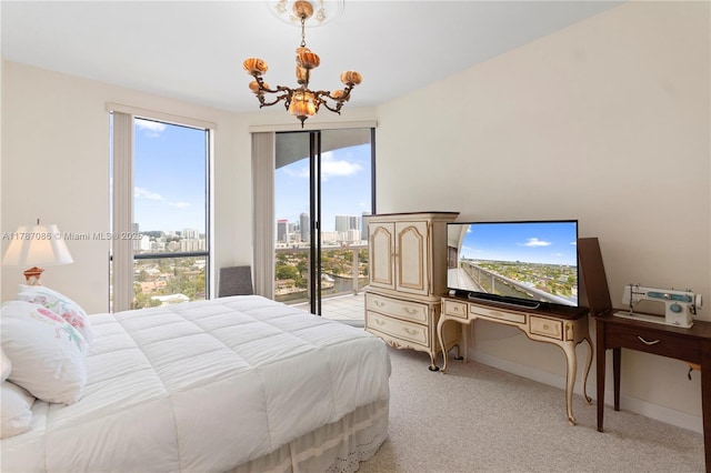 bedroom featuring light carpet, access to outside, a chandelier, and baseboards