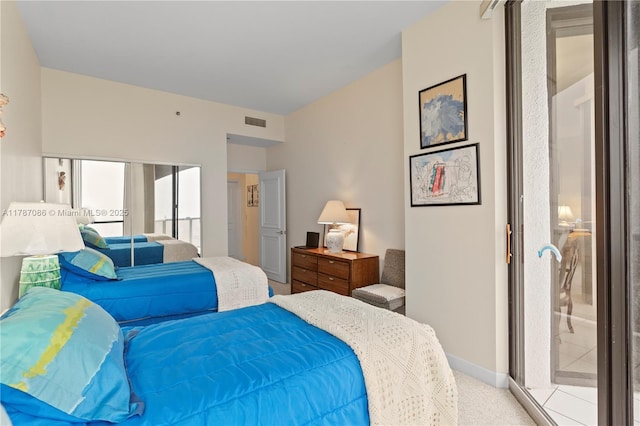 carpeted bedroom with baseboards, visible vents, and access to outside