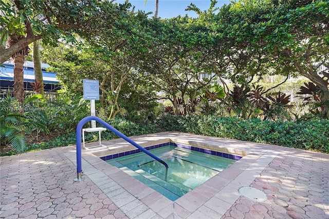 view of pool featuring a hot tub