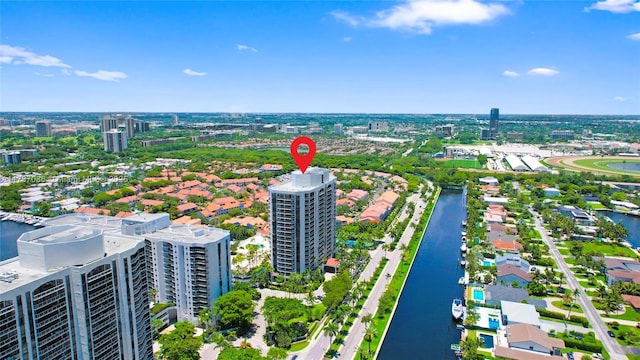 drone / aerial view featuring a view of city and a water view