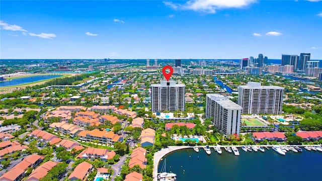 bird's eye view featuring a water view and a view of city