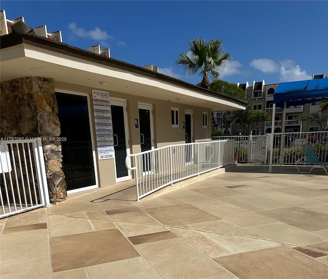 entrance to property with stone siding
