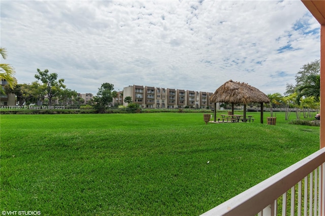 view of home's community with a lawn and a gazebo