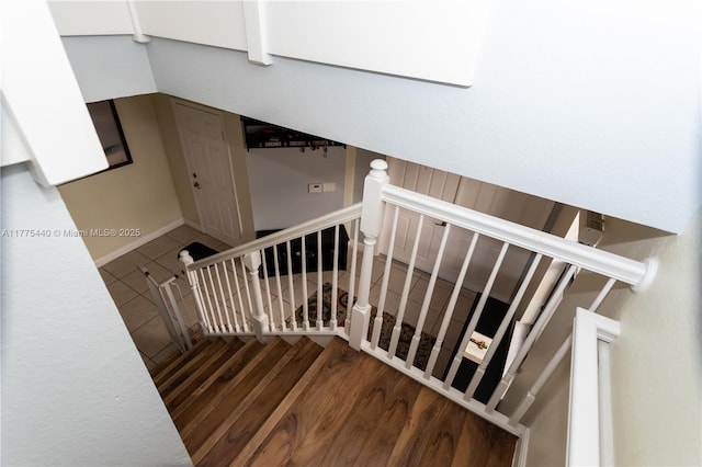 stairway with wood finished floors