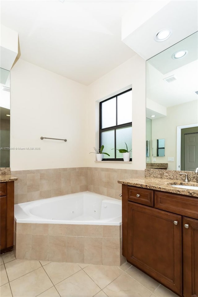 full bath featuring recessed lighting, tile patterned flooring, visible vents, vanity, and a tub with jets