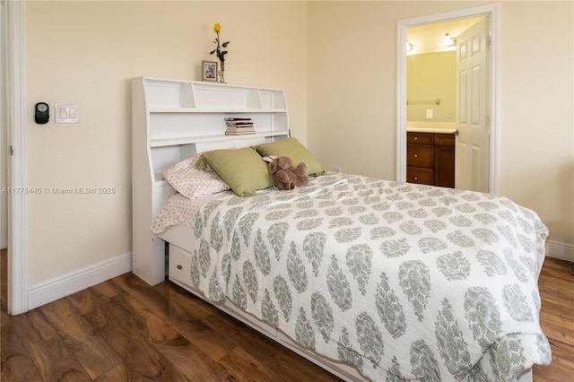 bedroom with baseboards, connected bathroom, and dark wood-style flooring