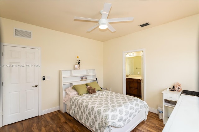 bedroom featuring dark wood-type flooring, visible vents, and baseboards