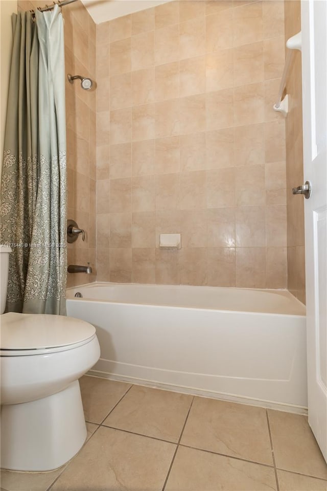 full bathroom with shower / bath combo, toilet, and tile patterned floors