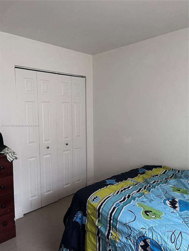 4335 NW 4th Ave, Deerfield Beach, FL 33064 - bedroom with tile patterned flooring and a closet