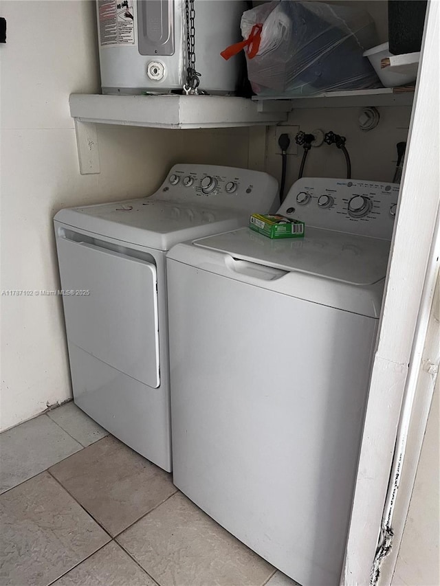 4335 NW 4th Ave, Deerfield Beach, FL 33064 - washroom with separate washer and dryer, water heater, and light tile patterned floors