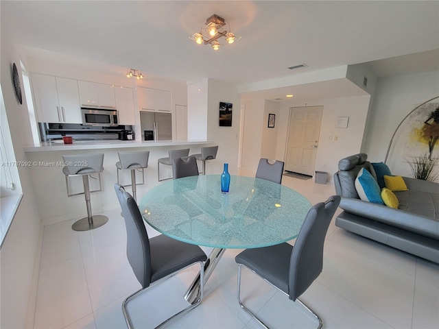 dining area featuring visible vents