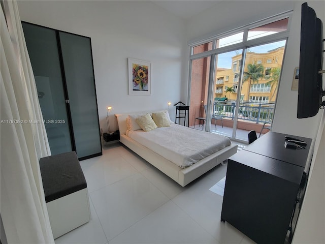 bedroom featuring multiple windows and access to exterior