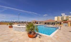 community pool with a patio