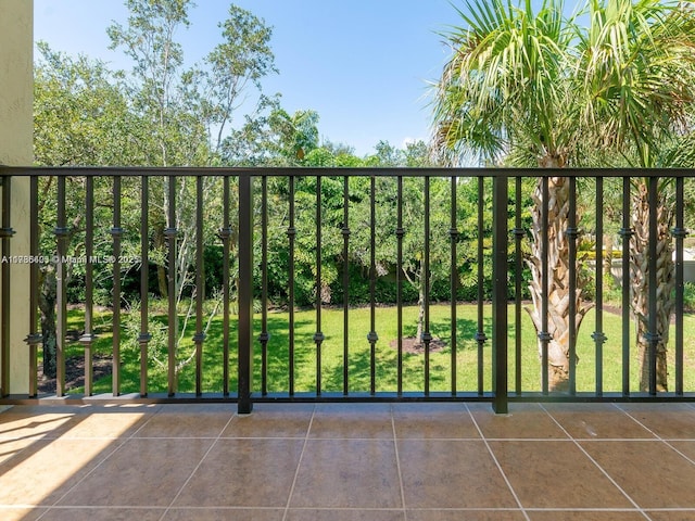 view of gate with a yard