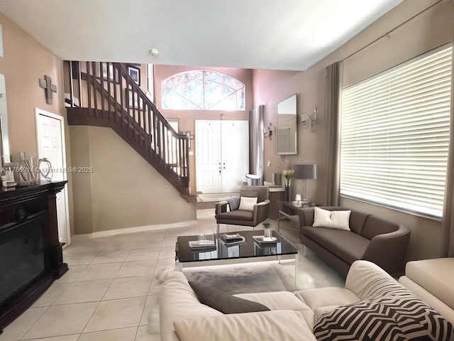 5337 SW 131st Ter, Miramar, FL 33027 - living area with light tile patterned floors, stairs, and baseboards