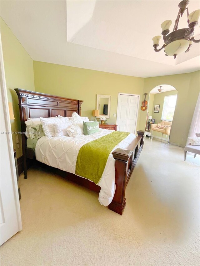 5337 SW 131st Ter, Miramar, FL 33027 - bedroom with arched walkways, carpet flooring, and a closet