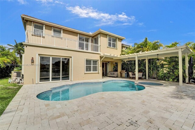 5337 SW 131st Ter, Miramar, FL 33027 - view of pool featuring a patio area, an outdoor living space, and a pool with connected hot tub