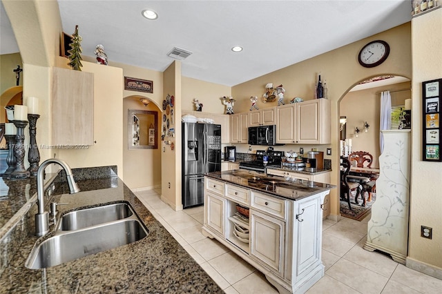 5337 SW 131st Ter, Miramar, FL 33027 - kitchen with refrigerator with ice dispenser, black microwave, a sink, arched walkways, and recessed lighting