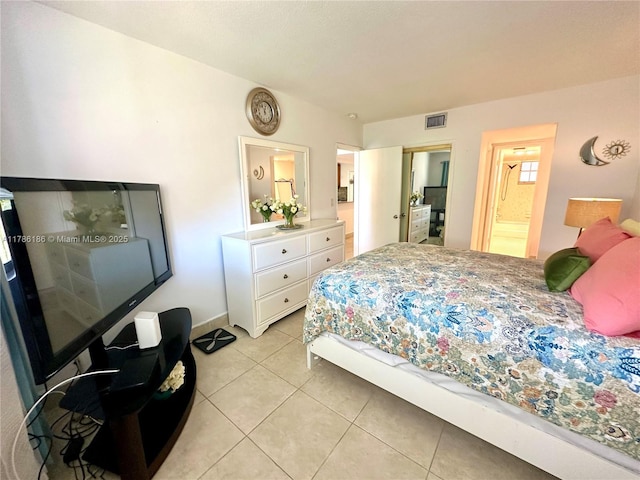 1001 Hillcrest Ct Unit 306, Hollywood, FL 33021 - bedroom featuring light tile patterned flooring, visible vents, baseboards, and connected bathroom