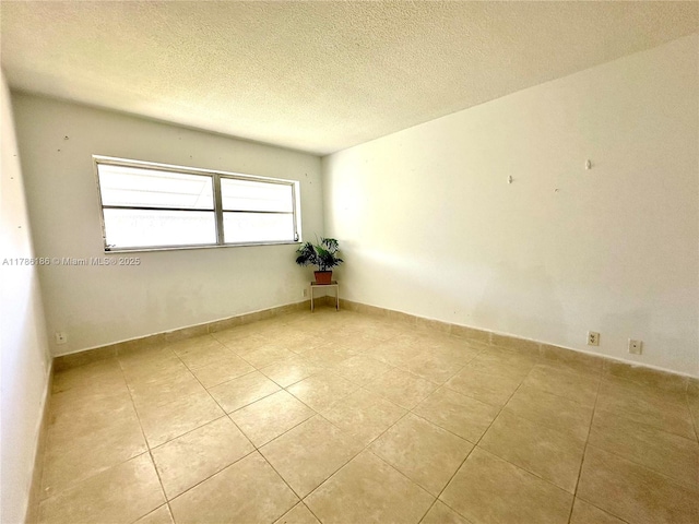 1001 Hillcrest Ct Unit 306, Hollywood, FL 33021 - empty room with a textured ceiling and light tile patterned floors