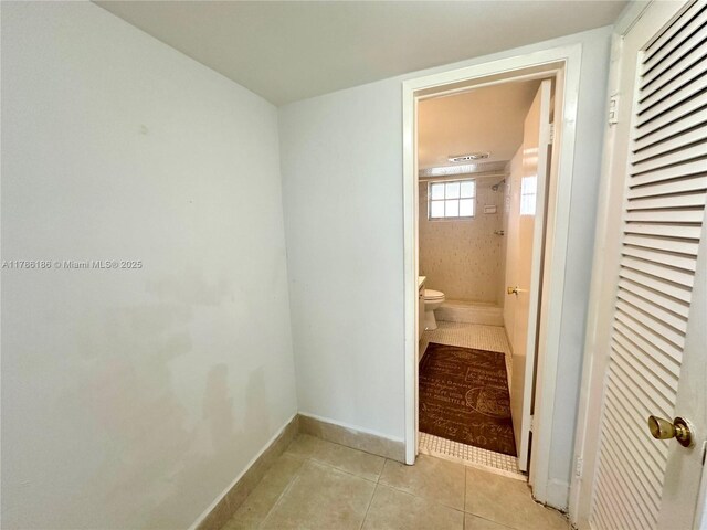 1001 Hillcrest Ct Unit 306, Hollywood, FL 33021 - bathroom with tile patterned floors, walk in shower, baseboards, and toilet