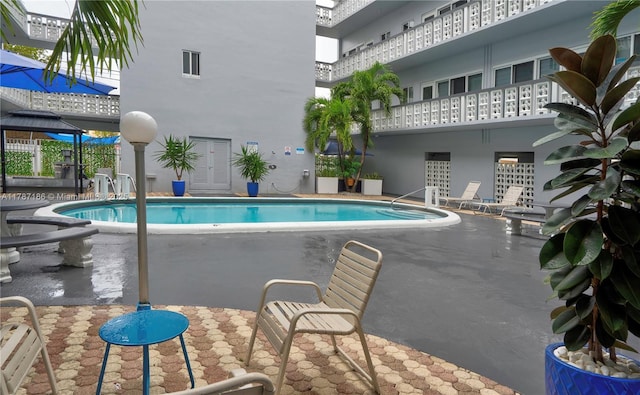 1818 Rodman St Unit 2E, Hollywood, FL 33020 - community pool with a gazebo and a patio