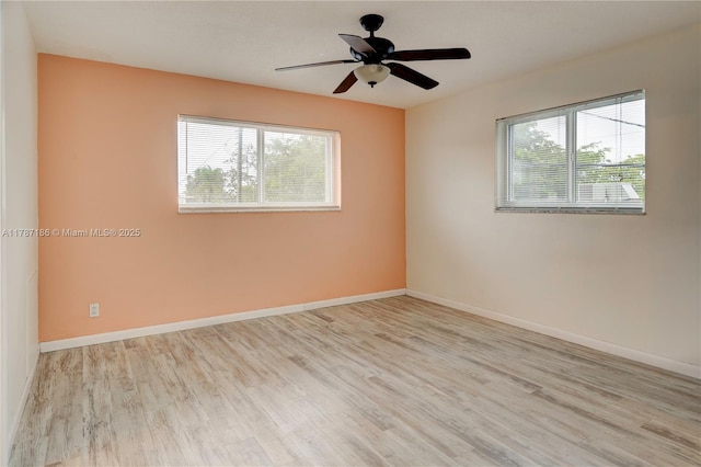 1818 Rodman St Unit 2E, Hollywood, FL 33020 - spare room featuring healthy amount of natural light, wood finished floors, baseboards, and ceiling fan