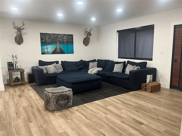 living room featuring recessed lighting and wood finished floors
