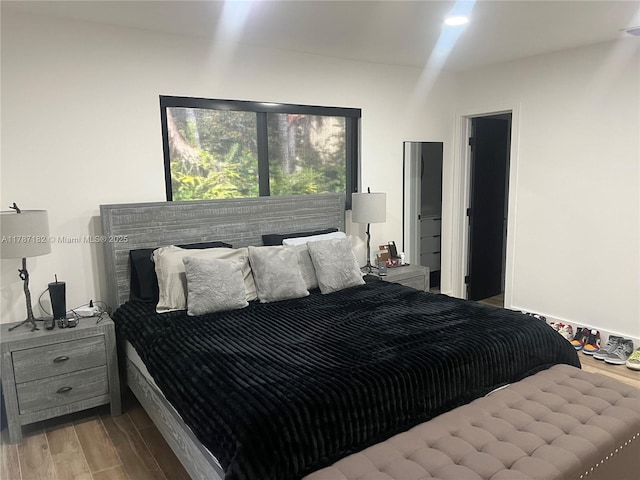 bedroom with wood finished floors