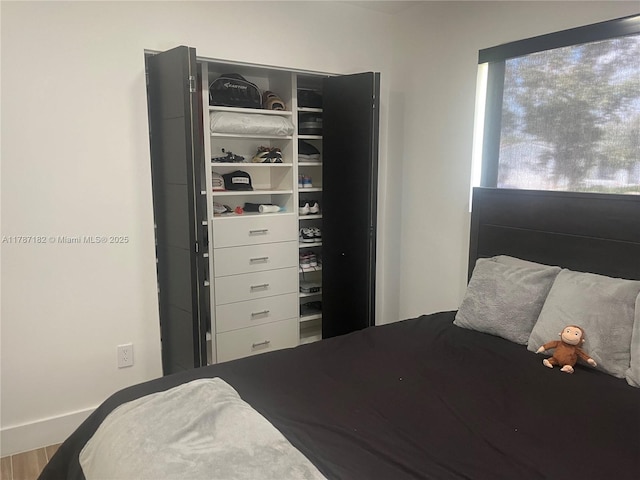 bedroom featuring wood finished floors