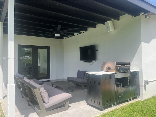 view of patio / terrace featuring ceiling fan and an outdoor living space