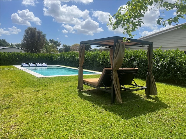 view of swimming pool with a yard, a gazebo, and a fenced in pool