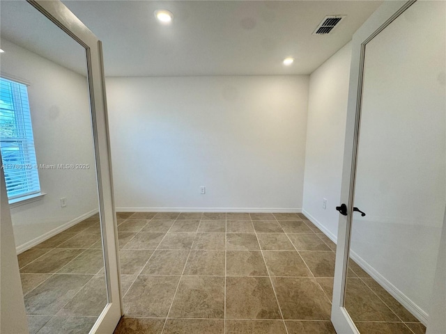 749 SE Karrigan Ter, Port St Lucie, FL 34983 - spare room featuring recessed lighting and baseboards