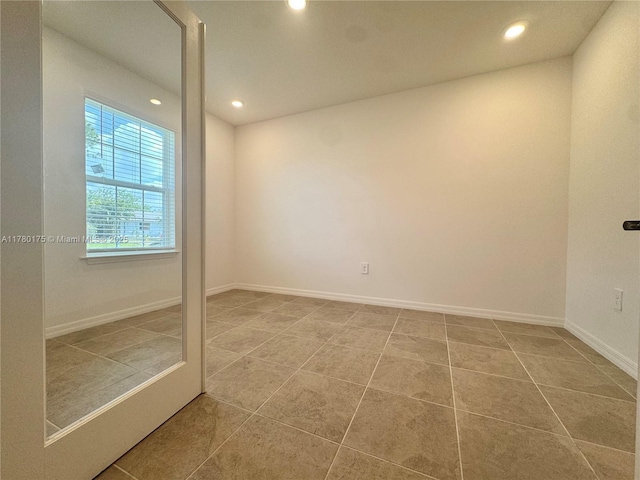 749 SE Karrigan Ter, Port St Lucie, FL 34983 - spare room with recessed lighting, tile patterned flooring, and baseboards