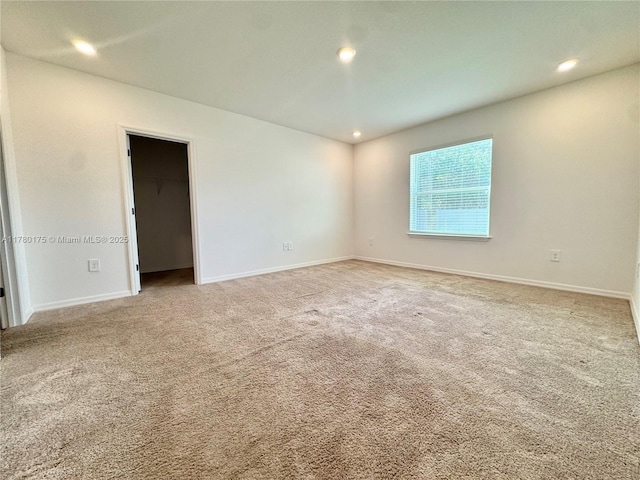 749 SE Karrigan Ter, Port St Lucie, FL 34983 - carpeted empty room featuring baseboards and recessed lighting