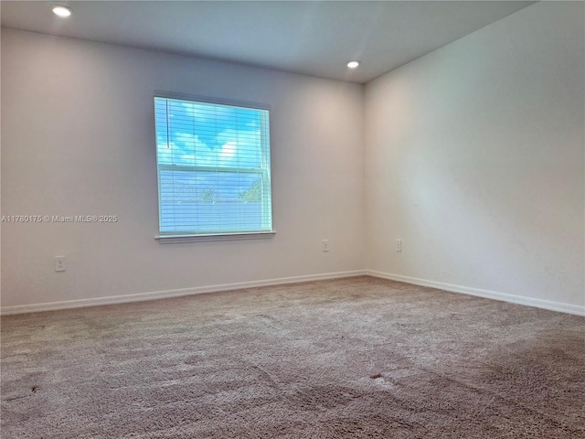 749 SE Karrigan Ter, Port St Lucie, FL 34983 - carpeted spare room with baseboards and recessed lighting