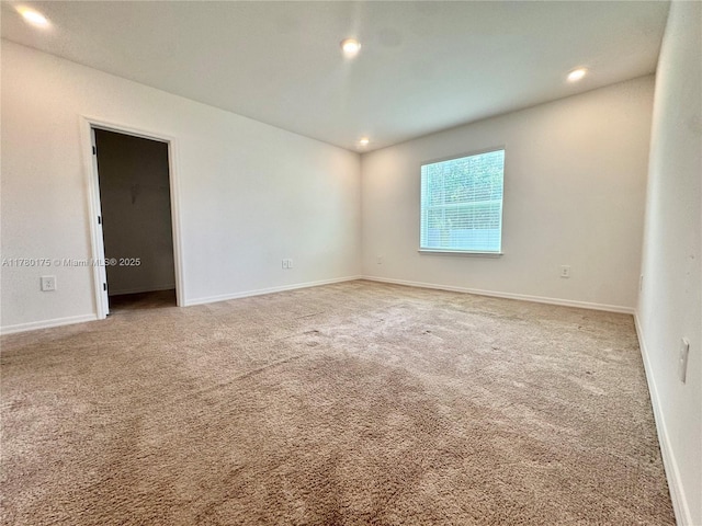 749 SE Karrigan Ter, Port St Lucie, FL 34983 - carpeted empty room with recessed lighting and baseboards