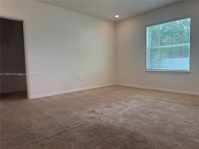 749 SE Karrigan Ter, Port St Lucie, FL 34983 - carpeted empty room featuring baseboards and recessed lighting