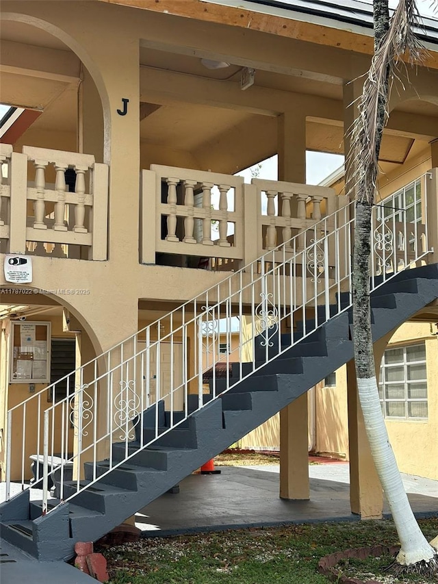 20311 NE 2nd Ave Unit 27, Miami, FL 33179 - exterior space featuring stairway and stucco siding