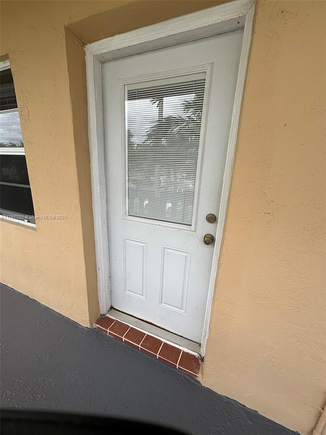 20311 NE 2nd Ave Unit 27, Miami, FL 33179 - view of exterior entry featuring stucco siding
