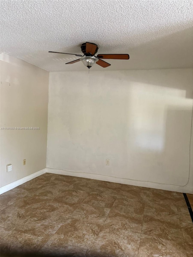 20311 NE 2nd Ave Unit 27, Miami, FL 33179 - spare room featuring ceiling fan, a textured ceiling, and baseboards
