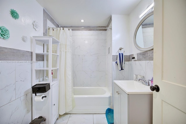 121 E Walnut St, Avon Park, FL 33825 - full bath with marble finish floors, vanity, shower / tub combo, tile walls, and recessed lighting