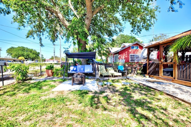 121 E Walnut St, Avon Park, FL 33825 - view of yard featuring an outdoor fire pit and a patio