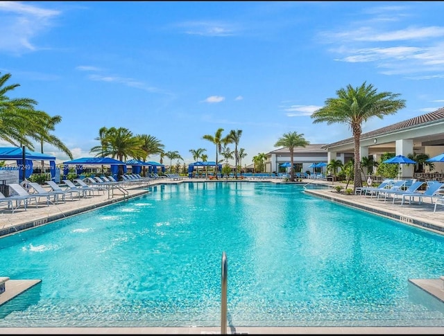 community pool with a patio area