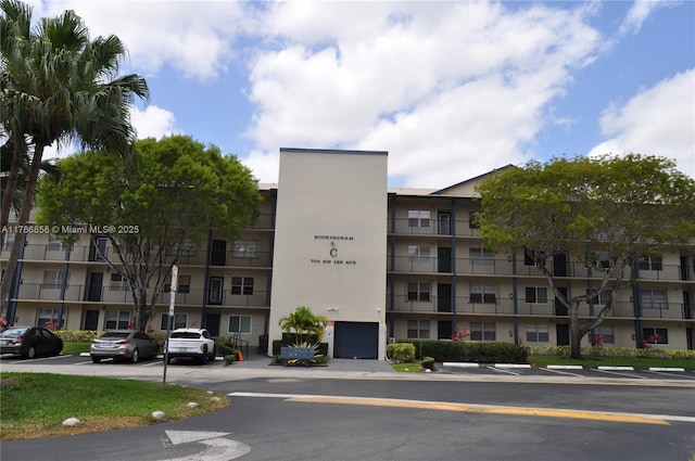 700 SW 128th Ave Unit 106C, Pembroke Pines, FL 33027 - view of apartment building / complex featuring uncovered parking