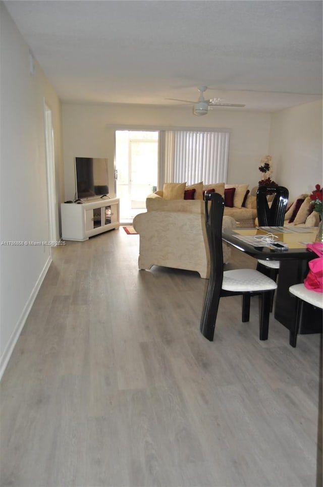 700 SW 128th Ave Unit 106C, Pembroke Pines, FL 33027 - dining space with ceiling fan, wood finished floors, and baseboards