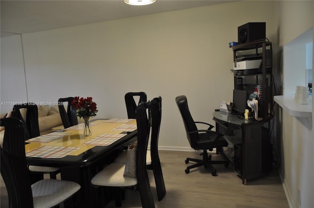 700 SW 128th Ave Unit 106C, Pembroke Pines, FL 33027 - dining space featuring light wood finished floors, baseboards, and an office area